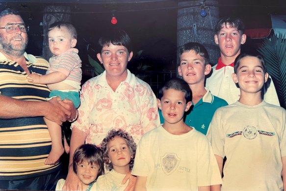 A family photo from 1993 at Airlie Beach, Queensland. Back row, from left: Tom, Lech, Lenore, Nathan and Trent Blaine. Front row, from left: Hannah, Rebecca, John and Steven Blaine.