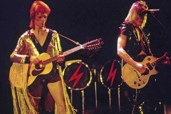 David Bowie and Mick Ronson on stage during the Ziggy Stardust era.