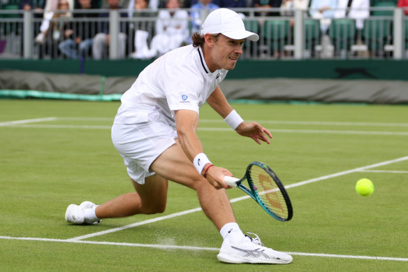 Alex De Minaur of Australia stretches to play a forehand against James Duckworth