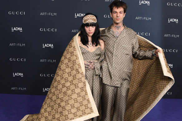 Billie Eilish and Jesse Rutherford in Gucci sleepwear and blanket at the LACMA gala in LA, November 2022.