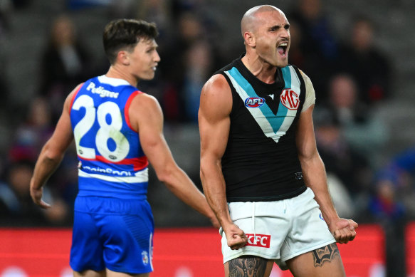 Sam Powell-Pepper celebrates after kicking a late goal to help seal the Power’s win over the Bulldogs.