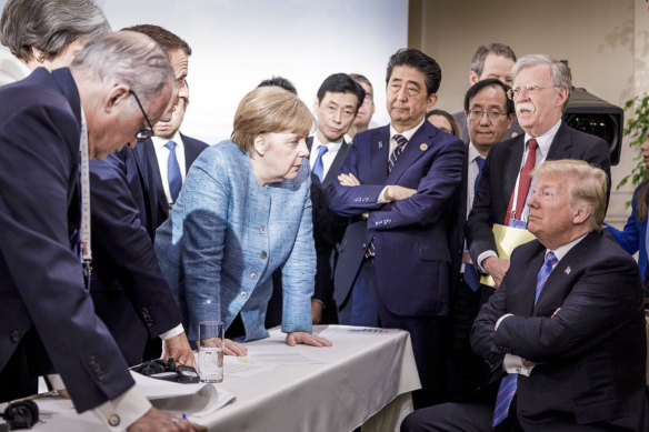 Chancellor Angela Merkel and Donald Trump with other world leaders at the G7 summit in Quebec in 2018. 