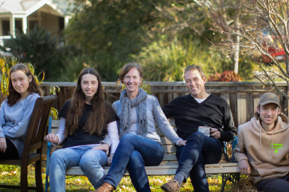 Melissa and James Thyer (centre) with their children, Ella, Alexandra and Ted.