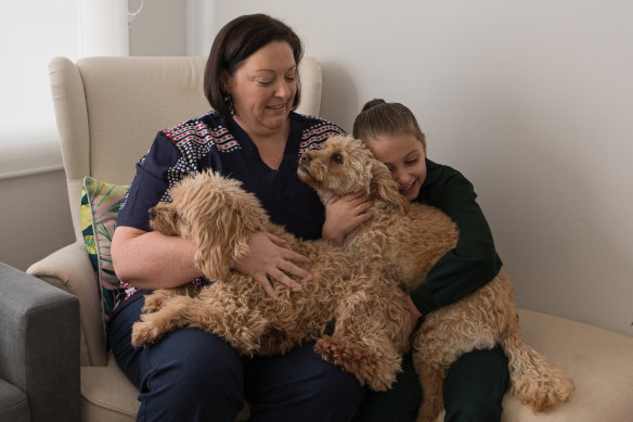 Belinda Renshaw, daughter Matilda and their dogs. The tax cuts may mean some nice steak on the dinner menu.