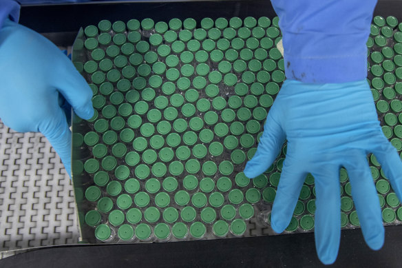 An employee packs a box containing coronavirus vaccines at the Serum Institute of India in Pune.