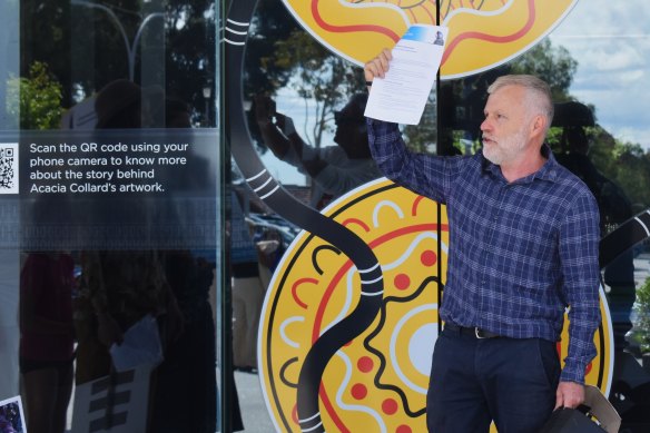 Paddy Cullen, and a group of protestors wearing black cockatoo masks, brought the letter to Dumas House on Friday.