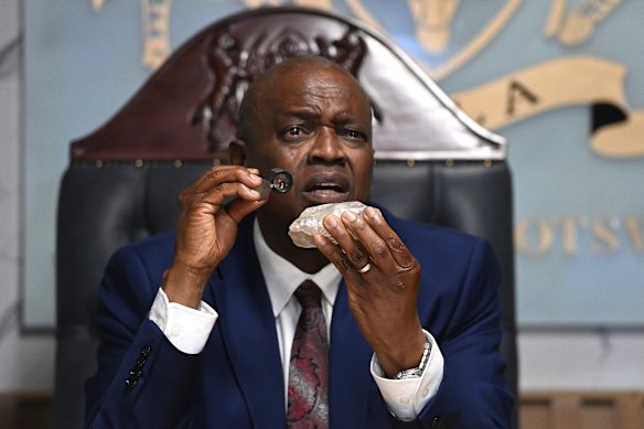 Former Botswanan president, Mokgweetsi Masisi, last year holds a 2492-carat diamond found in the country.