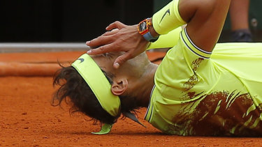 Clay master: Rafael Nadal wears the red of Rolland Garros after winning his 12th French Open title. 