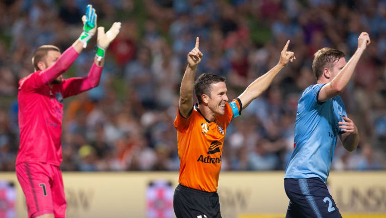 Mixed reaction: Matt McKay celebrates scoring while Sydney's Aaron Calver and Andrew Redmayne appeal for handball.