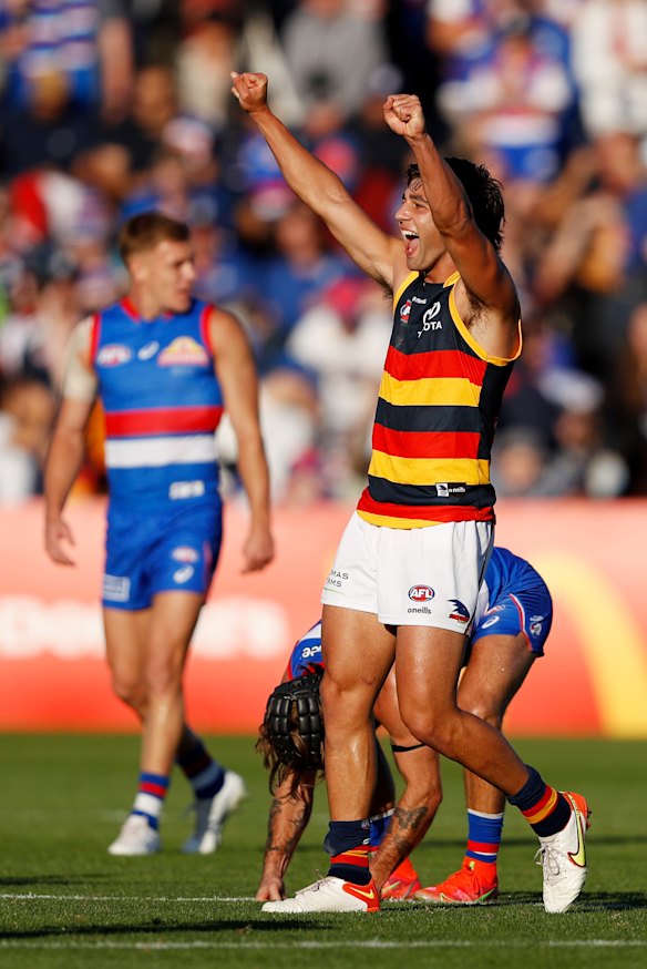 Josh Rachele celebrates the Crows’ upset win.