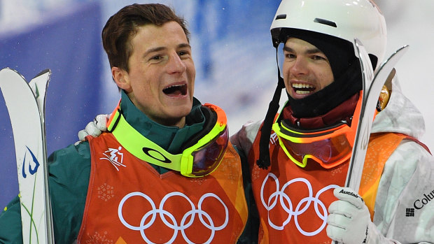 Matt Graham of Australia and Mikael Kingsbury of Canada celebrate after winning the silver and gold respectively.