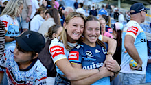 Maddison Levi hugs her sister Teagan after the latter’s debut for the Titans.
