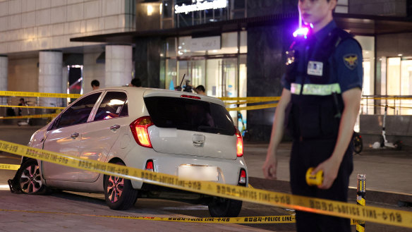 A policeman stands next to a scene where, according to media reports, nine people have been stabbed and four others hurt by a car driven by the suspected attacker in Seongnam, South Korea, August 3, 2023.   Yonhap via REUTERS   THIS IMAGE HAS BEEN SUPPLIED BY A THIRD PARTY. NO RESALES. NO ARCHIVES. SOUTH KOREA OUT. NO COMMERCIAL OR EDITORIAL SALES IN SOUTH KOREA.