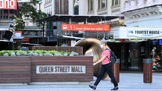  People are seen wearing face masks on the Queen Street Mall in the Brisbane CBD after  Annastacia Palazczuk announced a three-day lockdown.