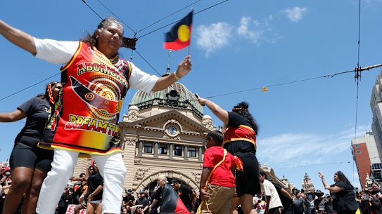 Invasion Day protestors outside Flinders Street Station on Thursday.