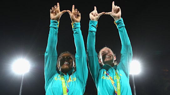 Ellia Green (left) and Chloe Dalton make the Warringah "W" after the medal ceremony at the Rio Olympics.