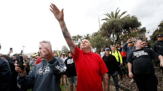 A protester issues a Nazi salute at Saturday's St Kilda rally.