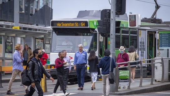 Commuters outside Melbourne’s Flinders Street Station on Monday.
