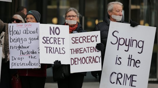 Protesters supporting Witness K’s former lawyer Bernard Collaery in front of the Law Courts in 2019.