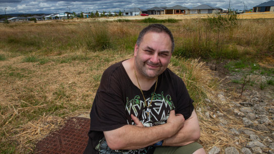 Hilbert resident Benny Rees in front of the “living stream” promised by developer Peet.