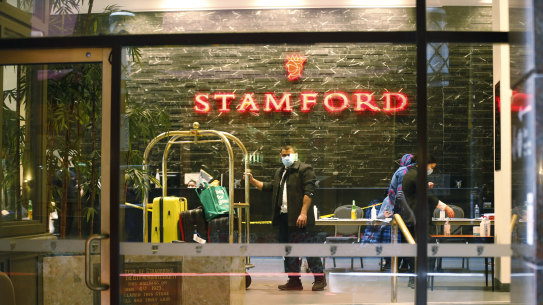 Hotel workers inside the Stamford Plaza, one of the quarantine hotels that became the site of an outbreak in 2020.