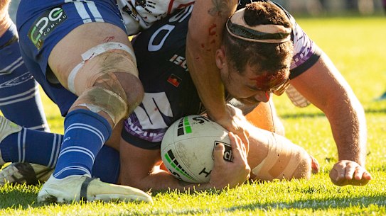 Jahrome Hughes continues after a clash of heads with teammate Dale Finucane at Belmore.