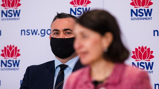 NSW Nationals leader John Barilaro with Premier Gladys Berejiklian. Mr Barilaro’s support for his government to revise the state’s emissions reductions to 50 per cent of 2005 levels by the end of this decade puts the NSW Nationals at odds with its federal party.