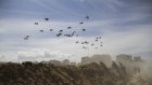 The United States Air Force drops humanitarian aid to Palestinians in Gaza City.