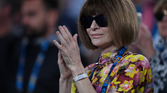Vogue editor Anna Wintour applauds after watching Serena Williams of the United States defeat Simona Halep of Romania during day eight of the Australian Open tennis tournament in Melbourne.