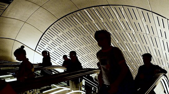 Commuters pass though the new Victoria Cross metro station.