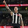 Tim Membrey of the Magpies kicks a goal.