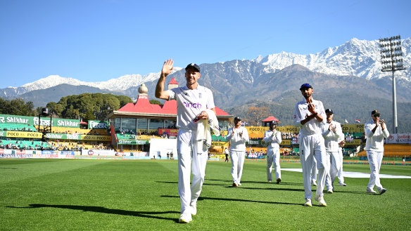 Jimmy Anderson leaves the field after claiming his 700th Test wicket, in India in March.