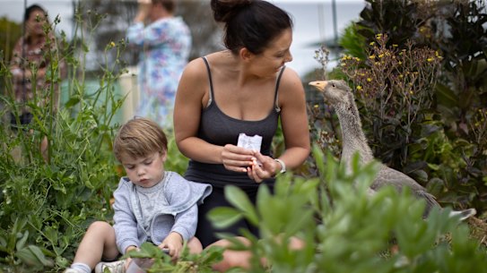 Nature play, in which children are allowed to direct their own activities outside and take small risks, can support early child development. Teddy,3, plays alongside his mother, Ash Smith at Little Farmers playgroup in Boneo on the Mornington Peninsular.