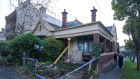 The home of an 84-year-old woman in North Melbourne after  a car crashed into it in June 2020.