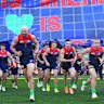 Melbourne captain Max Gawn leads the Demons on the field at the MCG. 