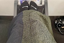 A bulkhead footrest adds a close-to-lie-flat experience for shorter passengers.