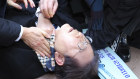 South Korean opposition leader Lee Jae-myung after he was stabbed in the neck.