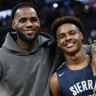 LeBron James, left, poses with his son Bronny .