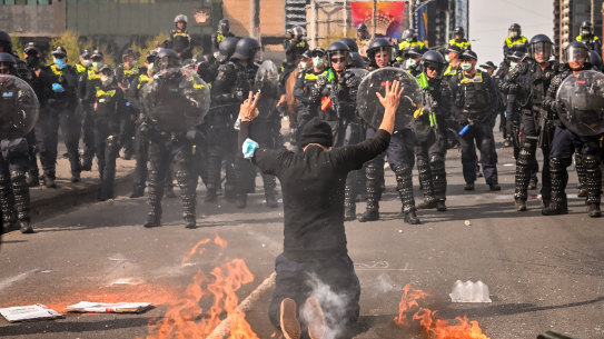 Protesters and police clash outside the Land Forces expo.