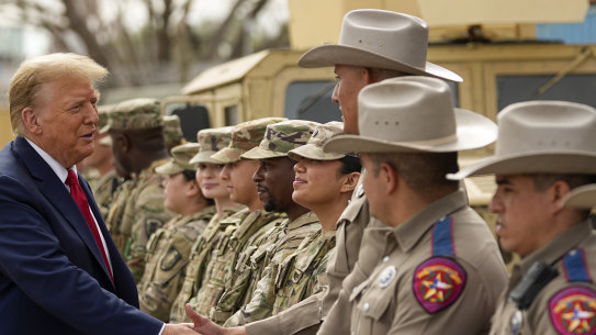 Donald Trump greets members of Texas Department of Public Safety as he visits Shelby Park on the US-Mexico border.