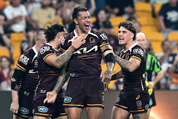 Xavier Willison of the Broncos celebrates after scoring a try
