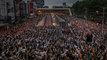 Not alone: Pro-democracy activists in Bangkok on Monday.