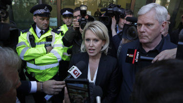 Kristinn Hrafnsson, editor of WikiLeaks (right), and barrister Jennifer Robinson (centre) speak outside court.