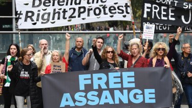 Supporters of Julian Assange and WikiLeaks are seen during a snap rally in Sydney.