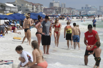 Beachgoers enjoy a sunny day in Florida this week.