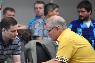 Australia's Minister for International Development Alex Hawke (left) and Prime Minister Scott Morrison confer  during the Pacific Islands Forum in Funafuti, Tuvalu on Friday.