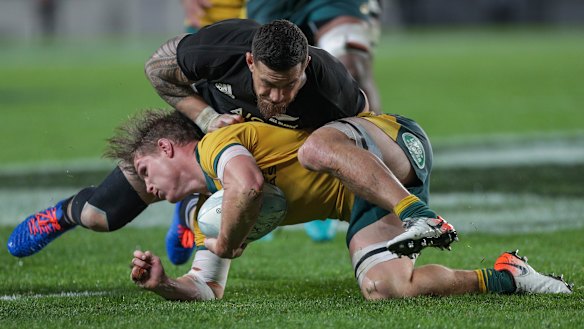 








Sonny Bill Williams crunches Wallabies skipper Michael Hooper.