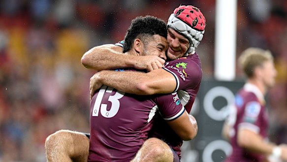 Paisami and Fraser McReight celebrate.