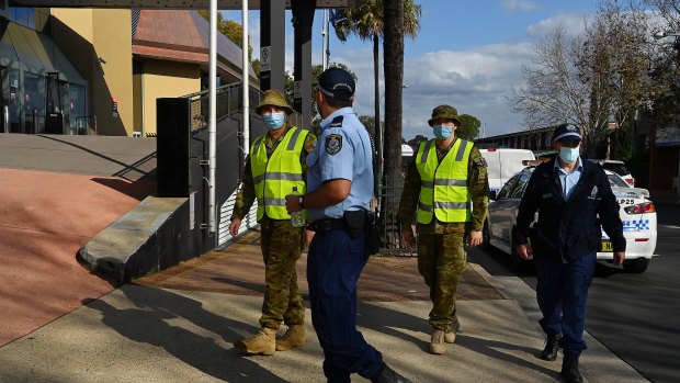 Police and the Australian Defence Force patrol the streets of Bankstown during the Delta lockdown. 