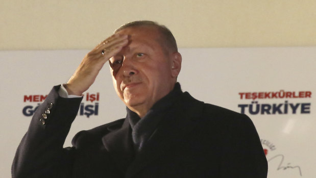 Turkey's President and ruling Justice and Development Party, or AKP, leader Recep Tayyip Erdogan greets supporters after the results of the local elections were announced in Ankara. 